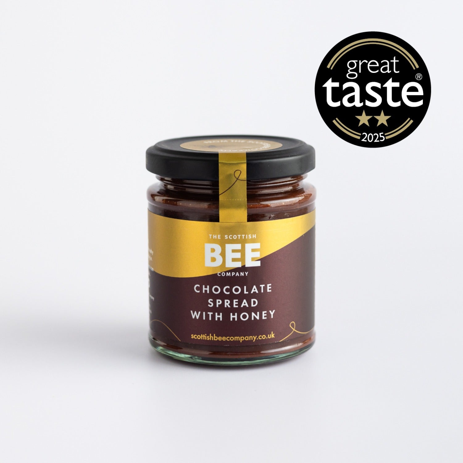 Jar of chocolate spread with honey from The Scottish Bee Company on a white background with &