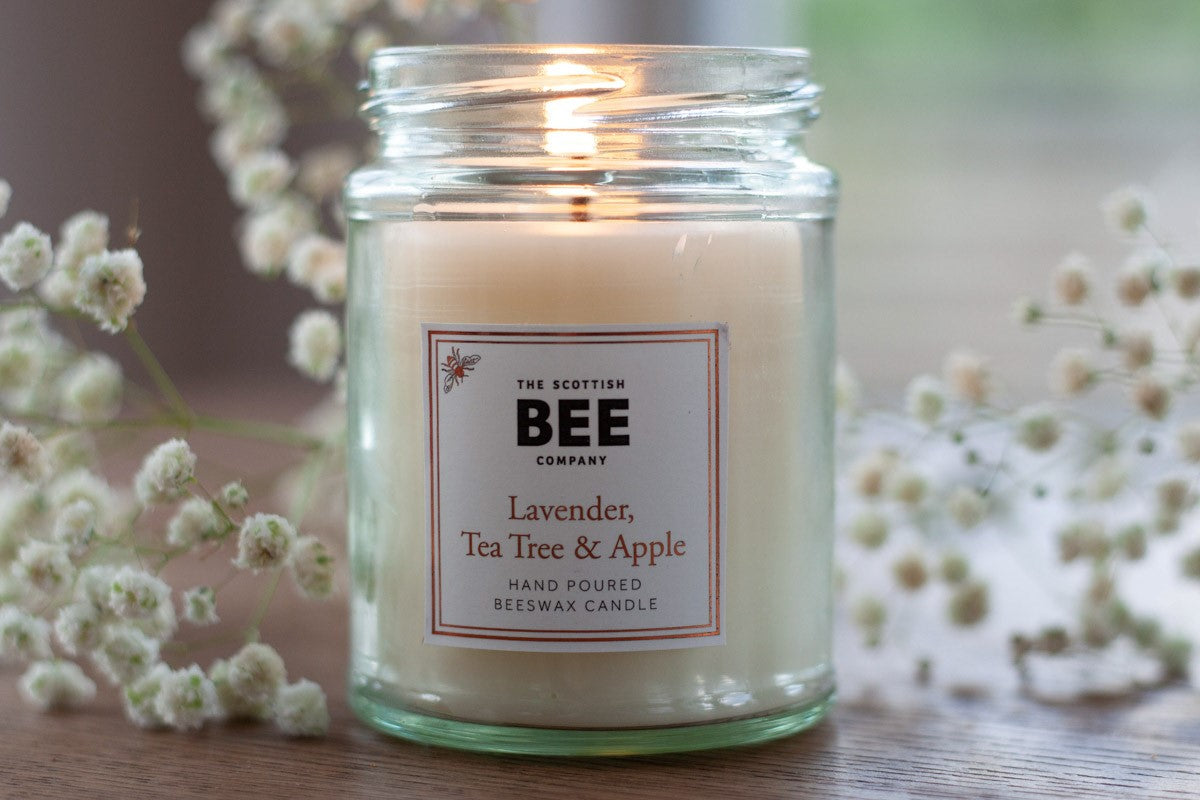 Scented beeswax candle on a table 