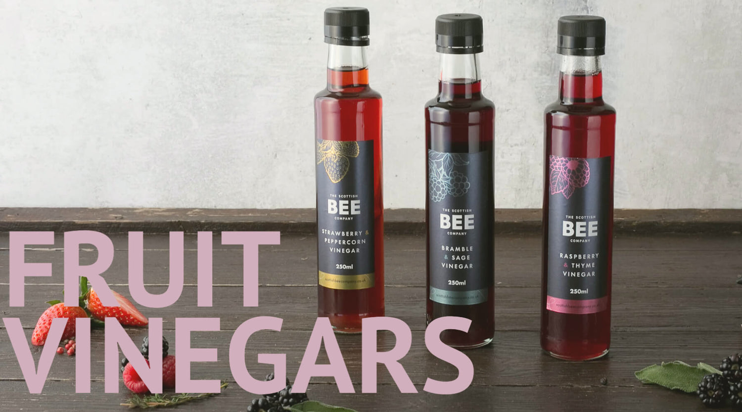 three flavours of fruit vinegars lined up with text 'fruit vinegars'