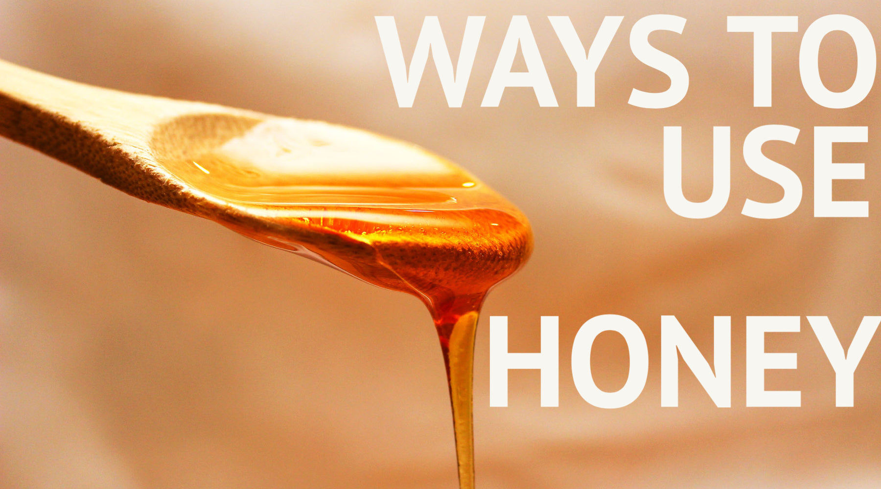 Honey dripping off wooden spoon with text 'ways to use honey'