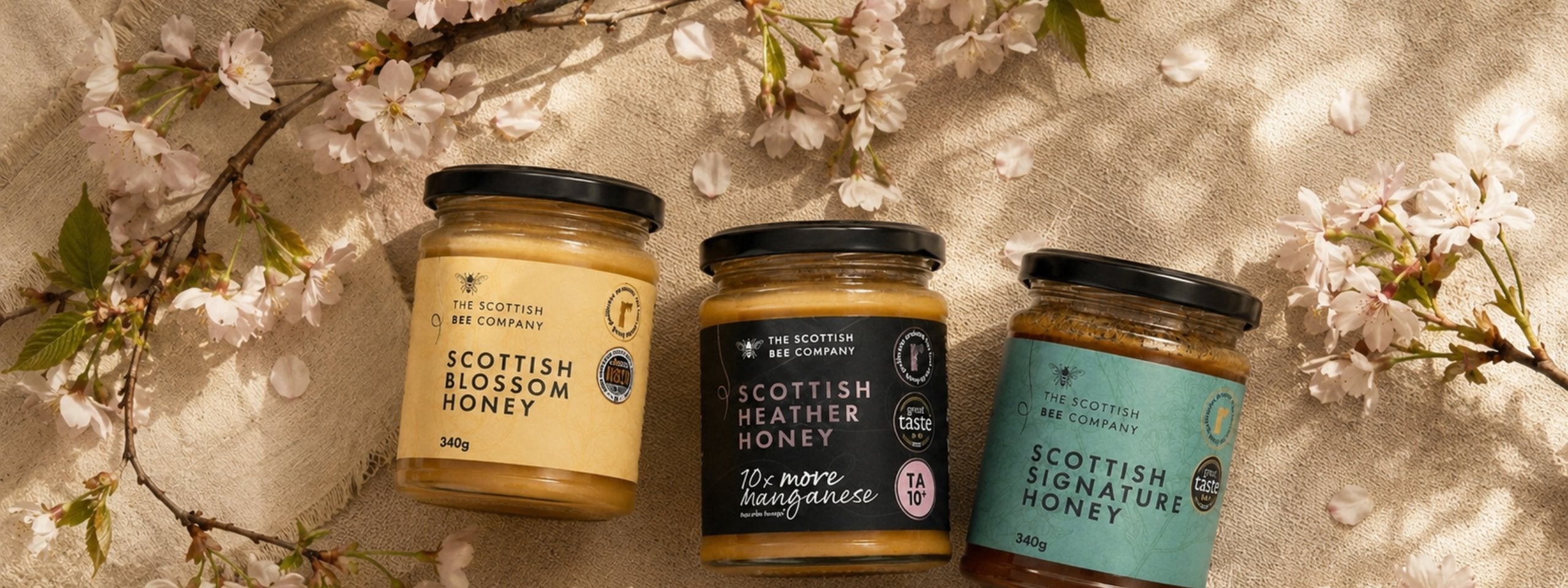scottish bee company heater, blossom and siganture jars and the hot honey duo on a lifestyle background