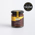 Jar of chocolate spread with honey from The Scottish Bee Company on a white background with &