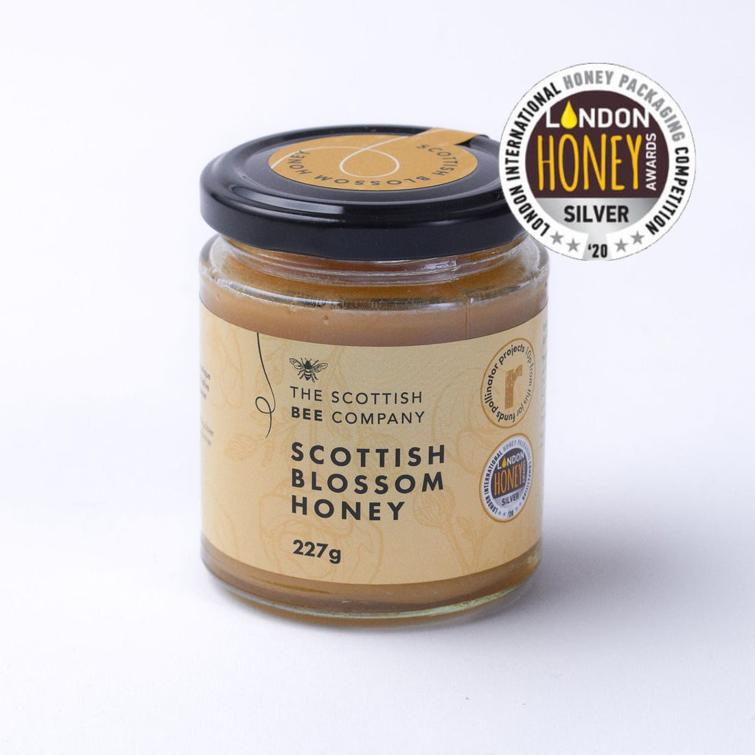 Jar of Scottish Blossom Honey from The Scottish Bee Company with a London Honey Award badge on a white background