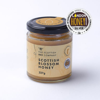 Jar of Scottish Blossom Honey from The Scottish Bee Company with a London Honey Award badge on a white background