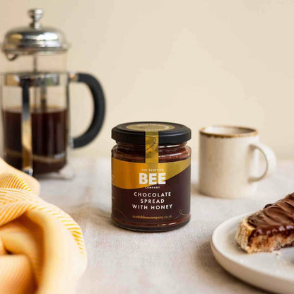 chocolate spread with honey next to toast and coffee