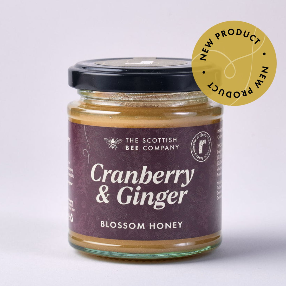 Jar of Cranberry &amp; Ginger Blossom Honey from The Scottish Bee Company on a light gray background
