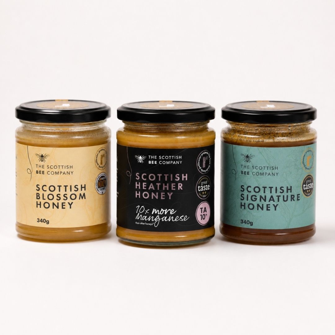 Three jars of honey from The Scottish Bee Company on a white background
