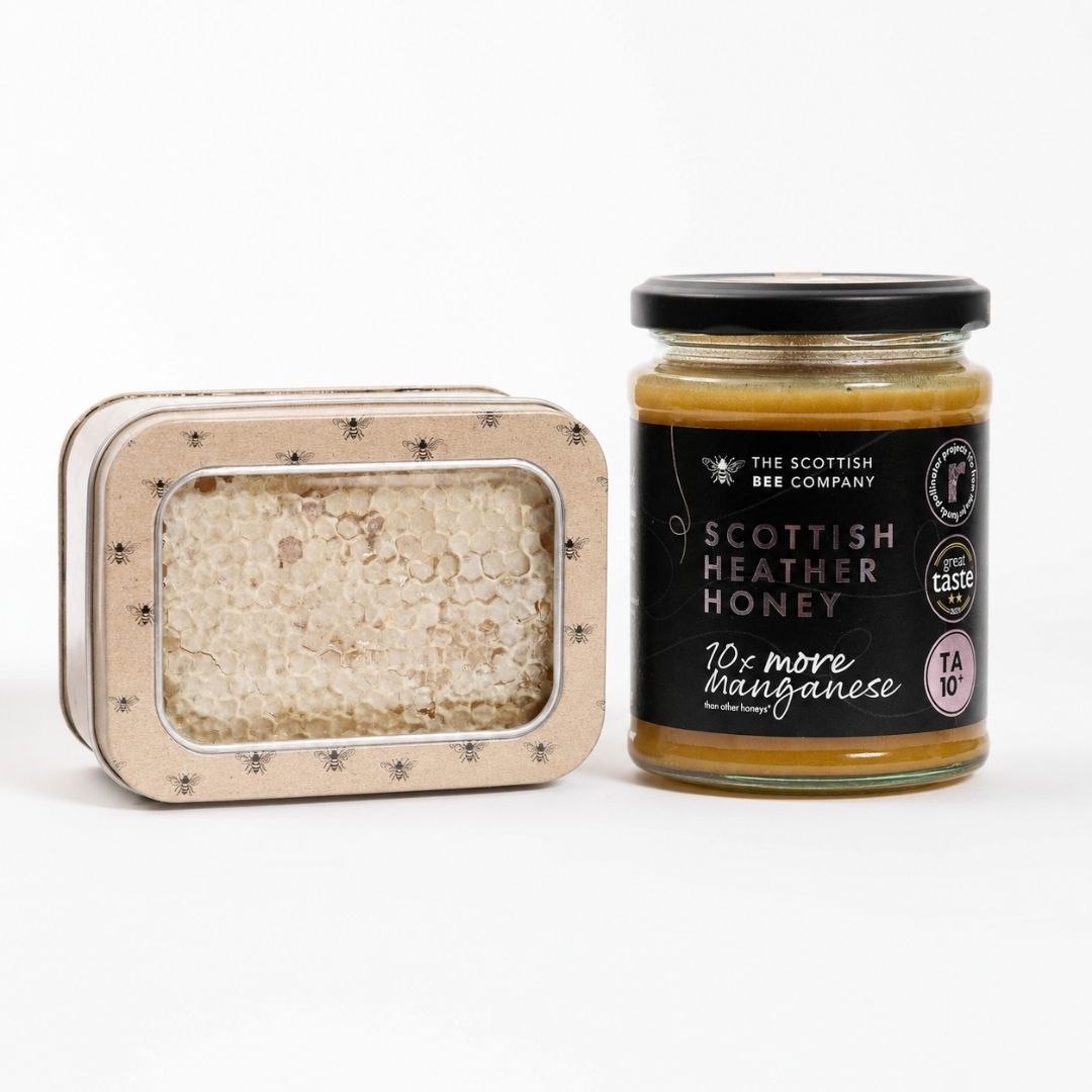 Jar of Scottish Heather Honey and a container of honeycomb on a white background