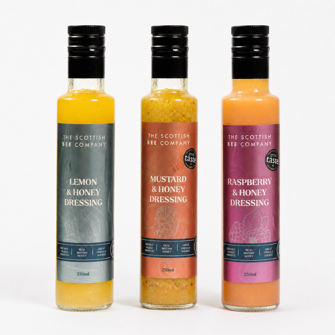 Three bottles of The Scottish Bee Company dressings on a white background