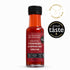 A 100ml bottle of Strawberry & Peppercorn Vinegar by The Scottish Bee Company, featuring a black cap and a red label, shown on a white background with a &